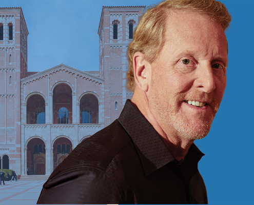 A composite image of a man with blonde hair wearing a black button down shirt in front of Royce Hall at UCLA.